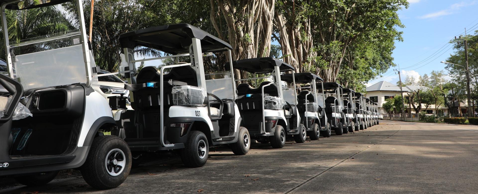 Tara golf carts are lined up on the course.